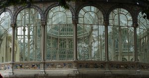 Picture of the glass windows of the orangerie called Palacio de Cristal, in the Parque del Retiro, in Madrid - Photo Credit: Matteo Pescarin